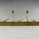 Gold coloured aluminium wall coat rack 1960’s