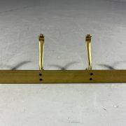 Gold coloured aluminium wall coat rack 1960’s