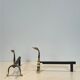 Pair of brass andirons with ducks. In the style of Maison Jansen.