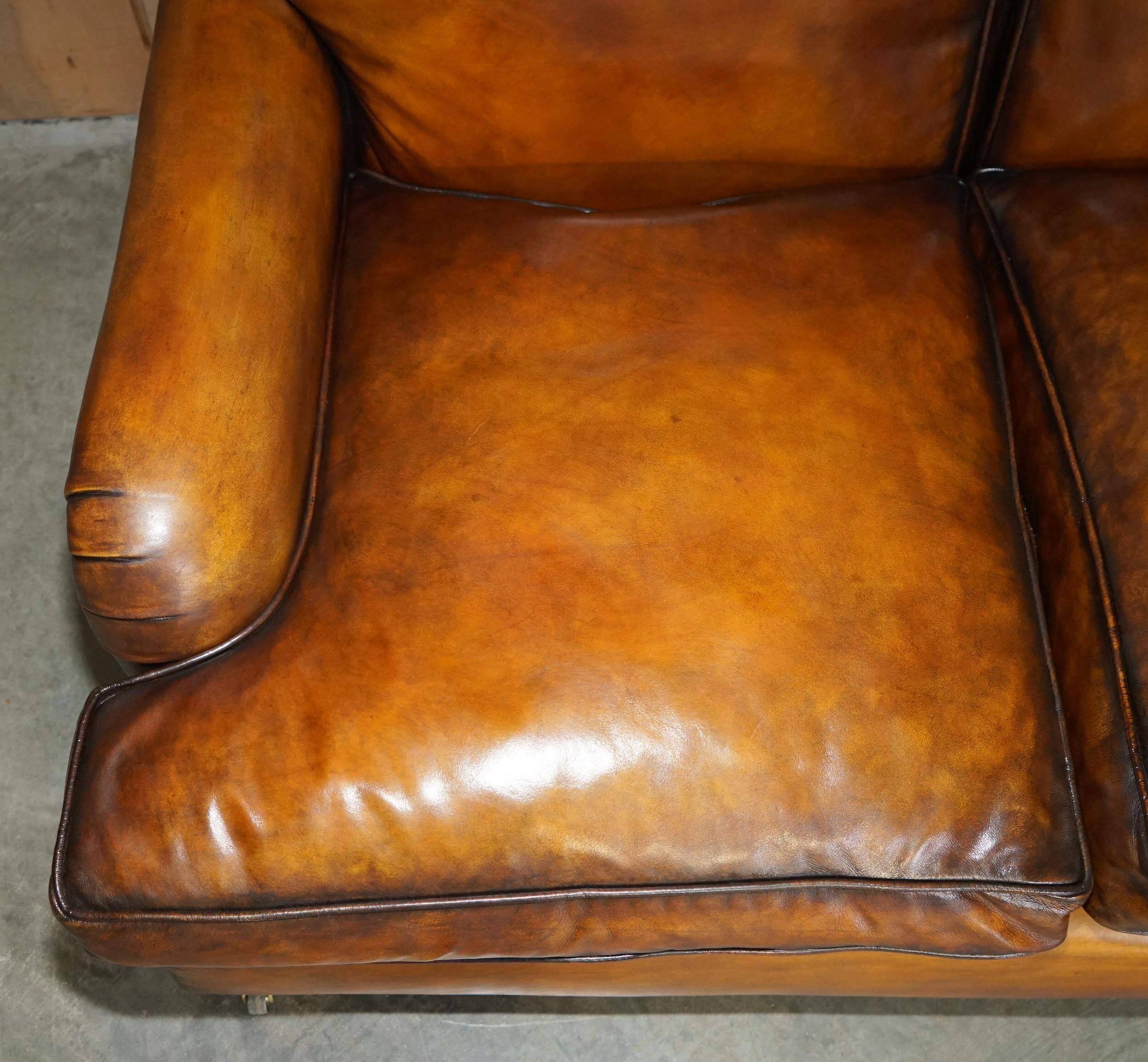 Howard & Son restored leather canapé, width 145 cm