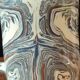 Handcrafted ceramic mug with marbled design, unique piece.