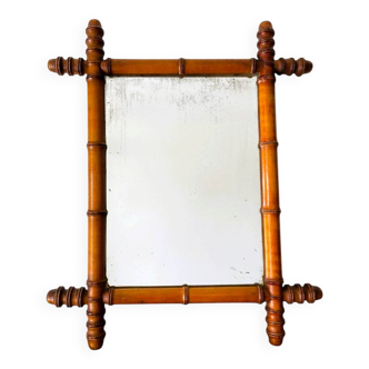 Vintage wooden mirror imitating bamboo