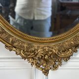 Mirror / oval ice Napoleon III period in wood and gilded stucco louis xv style