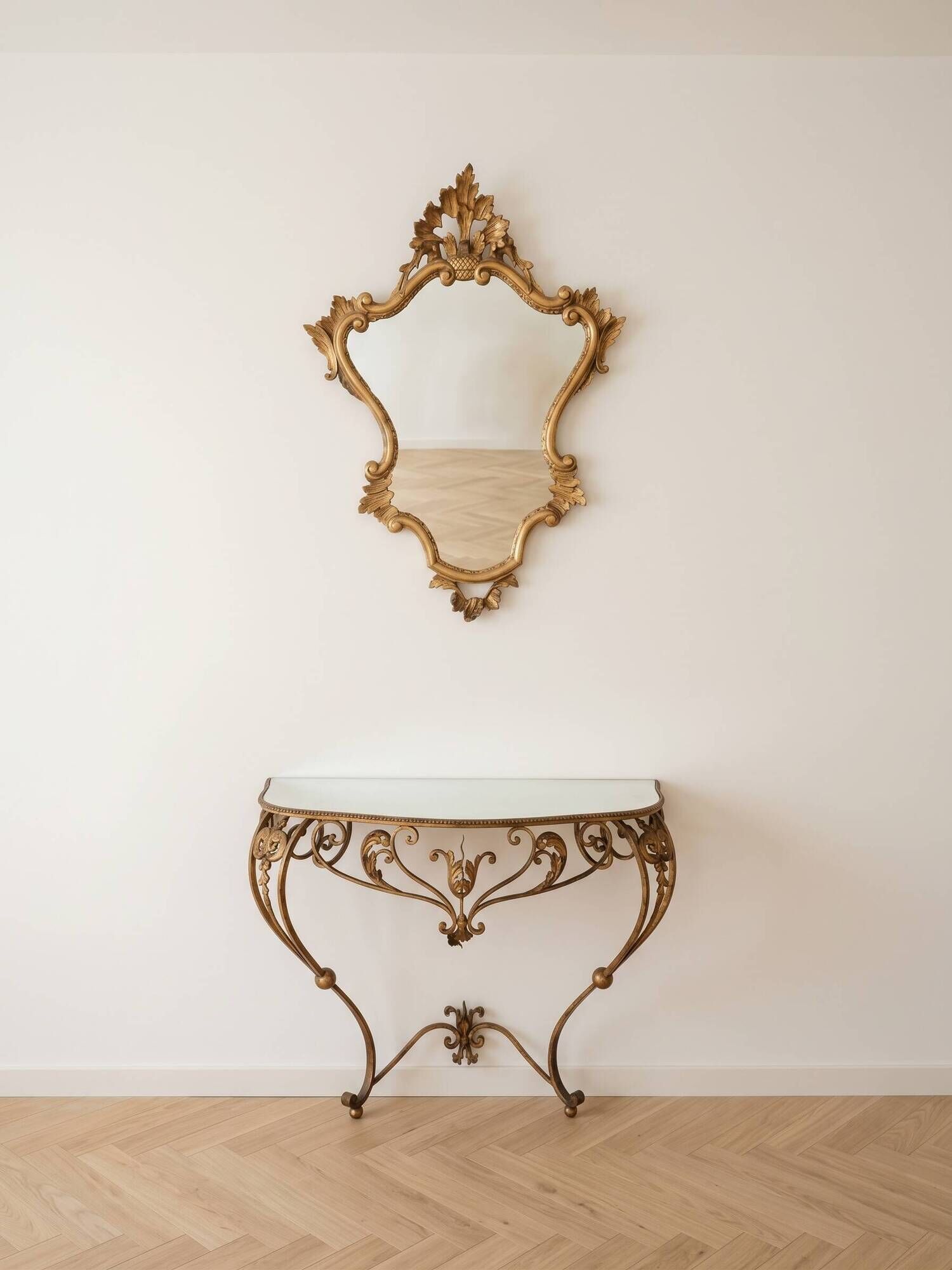 Golden wrought iron console and mirror in rococo style.
