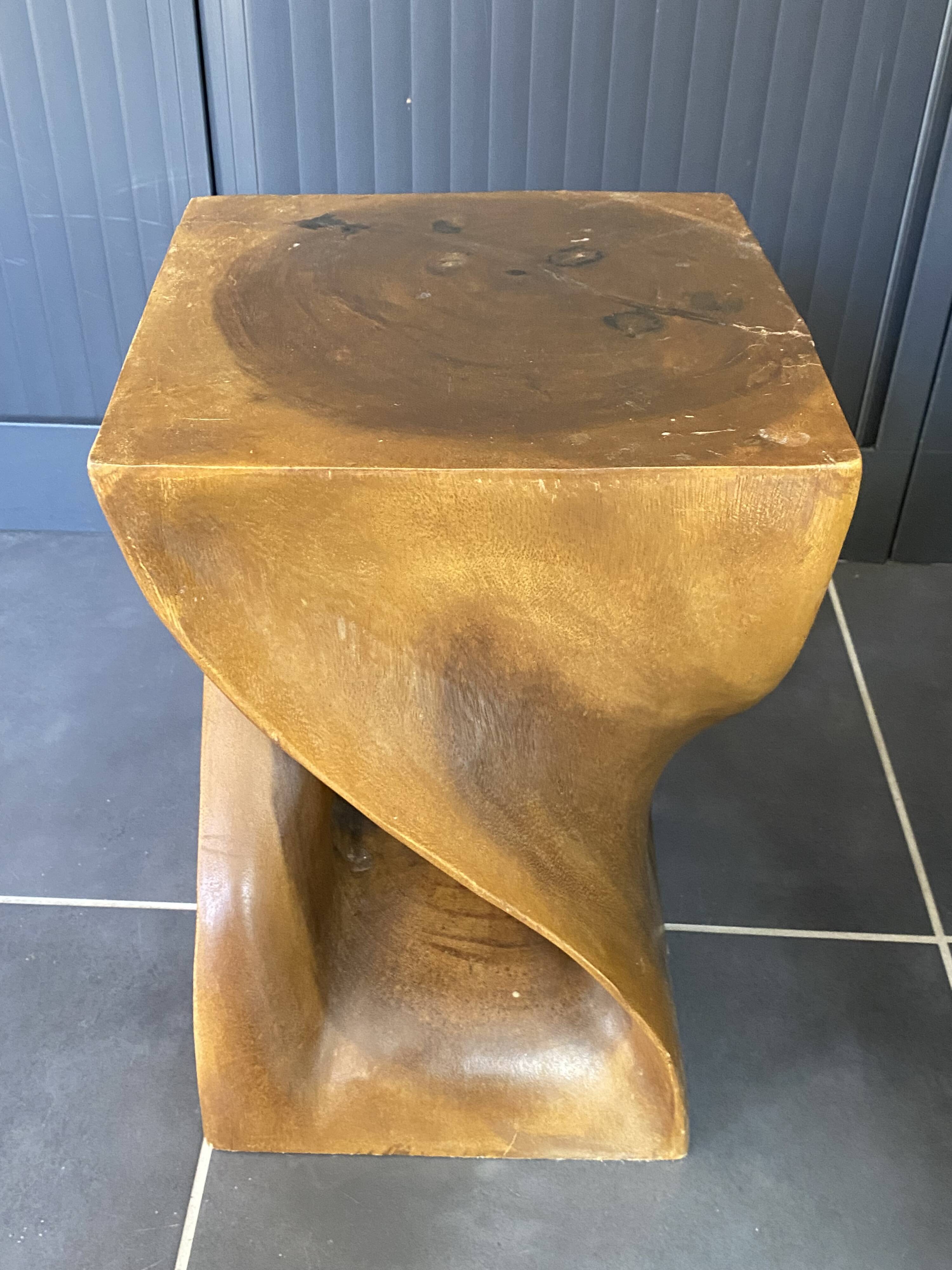 Stool n2 in solid raw walnut wood carved from the mass 1970