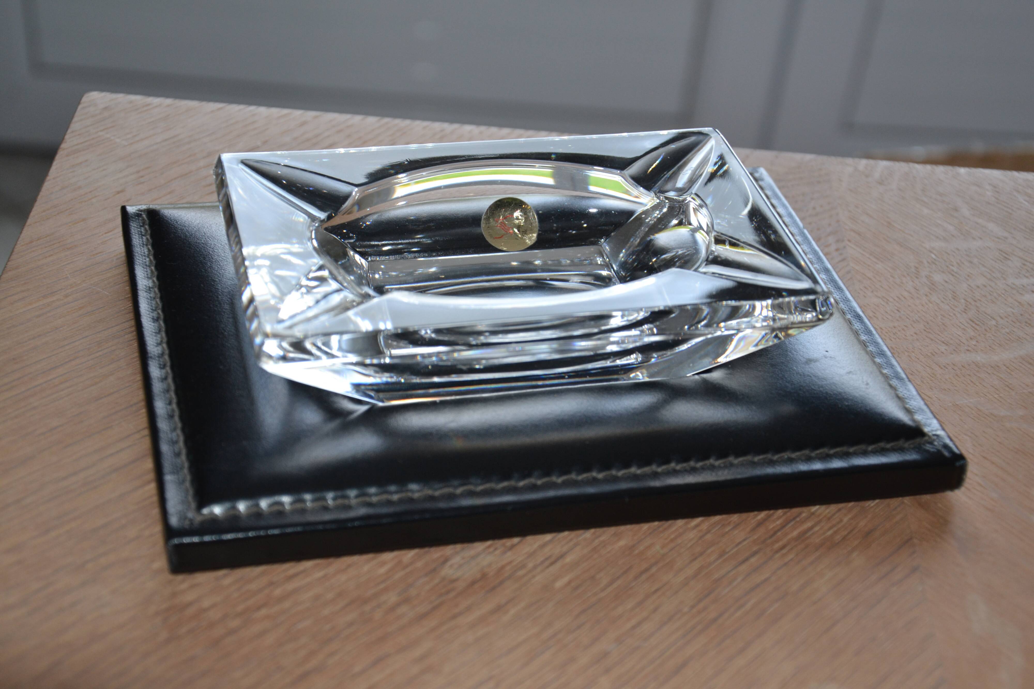 Antique crystal ashtray with its leather stand
