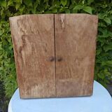Small freestanding or wall-mounted wooden cabinet.