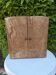 Small freestanding or wall-mounted wooden cabinet.