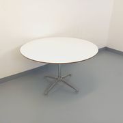 Vintage Eames round table for Vitra in white melamine, wood, and metal.
