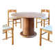 Round table with a central pedestal, light wood, 1990s.