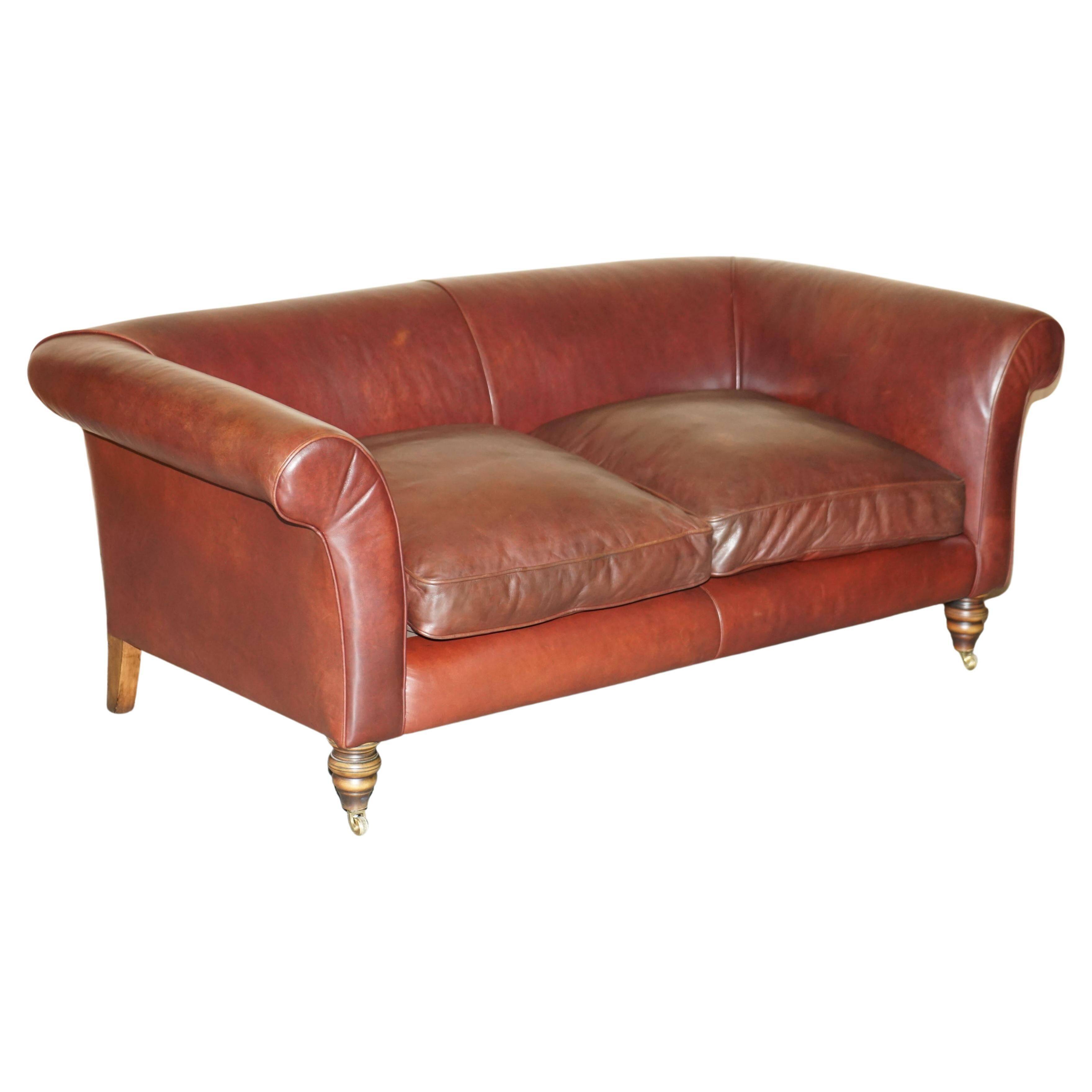 Vintage Art Deco leather sofa, three-seater, feather cushions.
