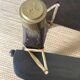 Pair of low Egyptian stools, camel saddles in wood, leather and brass