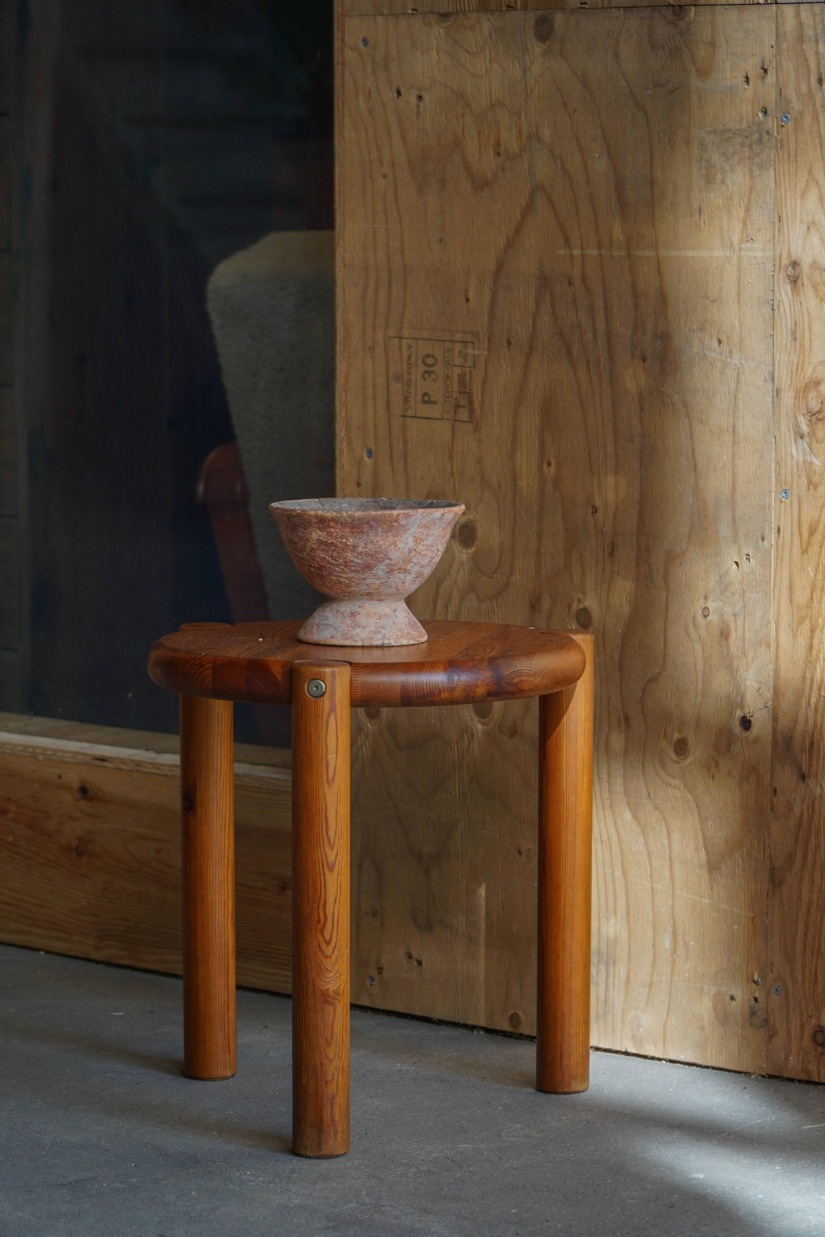 Modern Scandinavian tripod stool from the 20th century with a circular seat, 1970s.