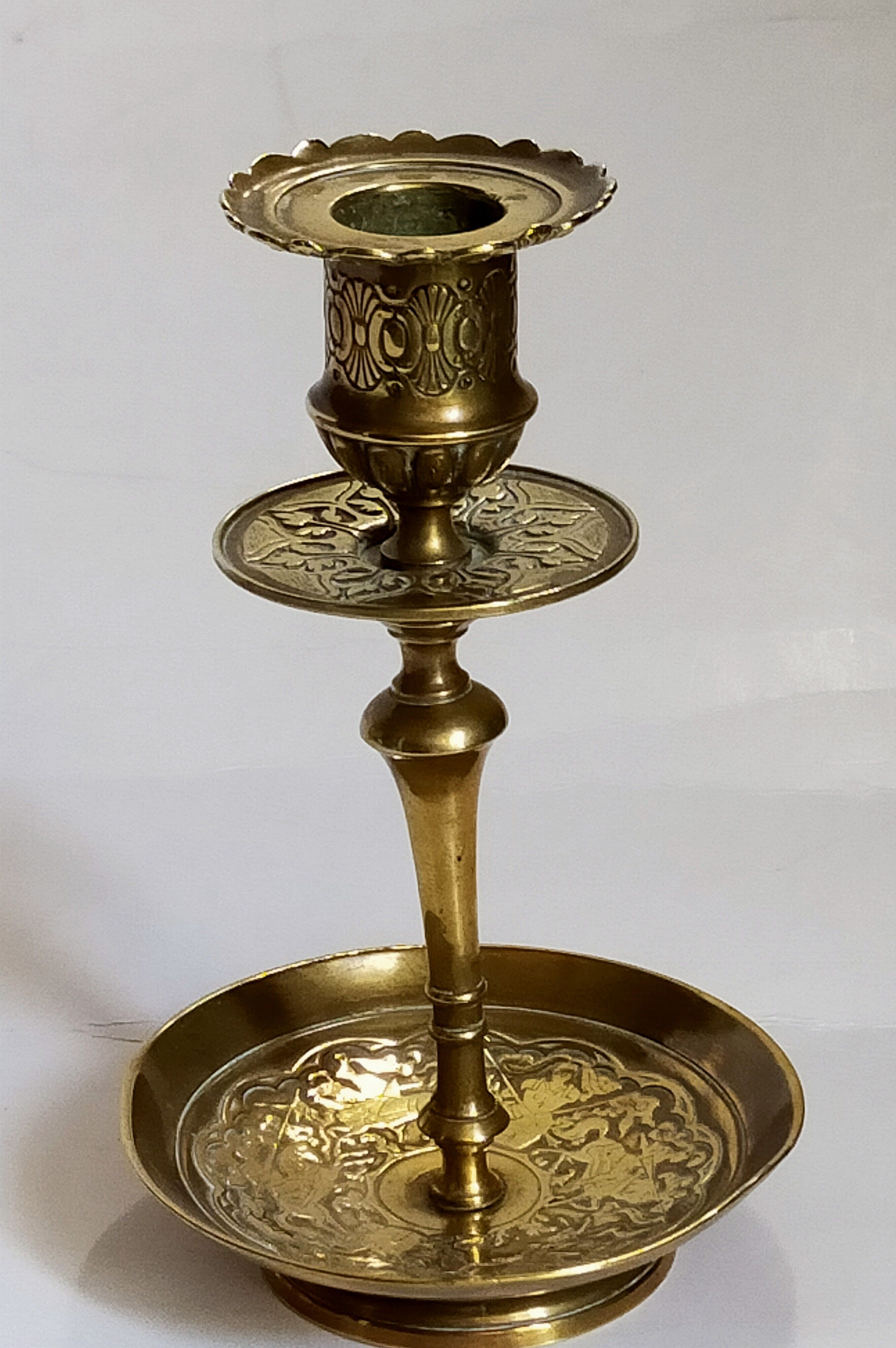 Duo of solid brass and gold metal candle holders worked old