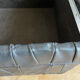 Black leather chest ottoman from Sède