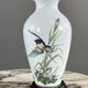 Pair of porcelain vases by Franklin, “The Meadowland Bird Vase”, 20th century.