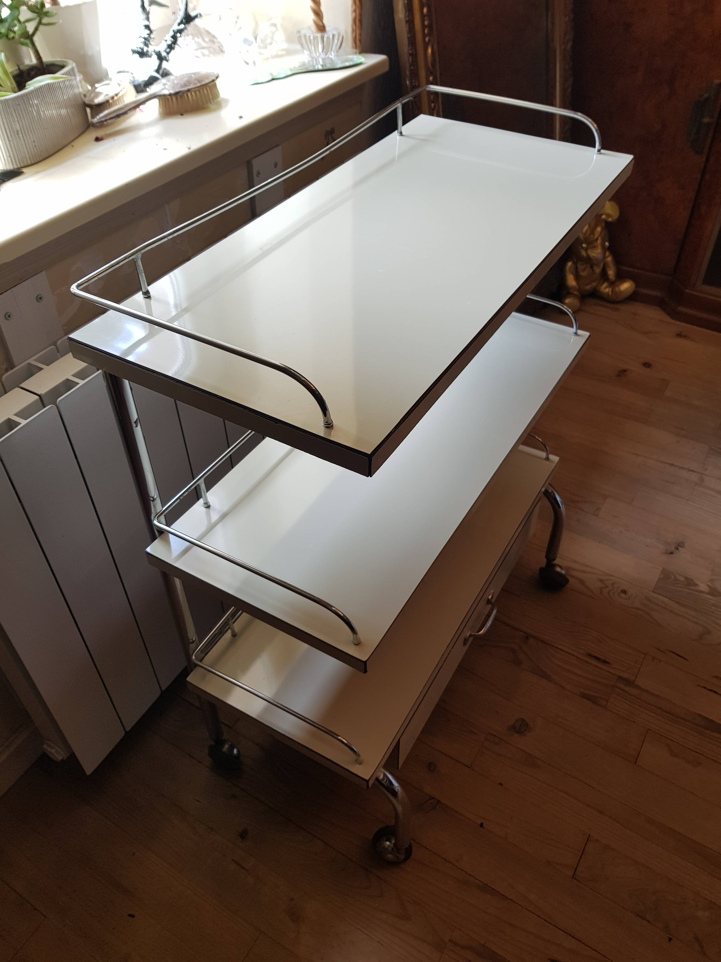 Rolling serving table with drawer