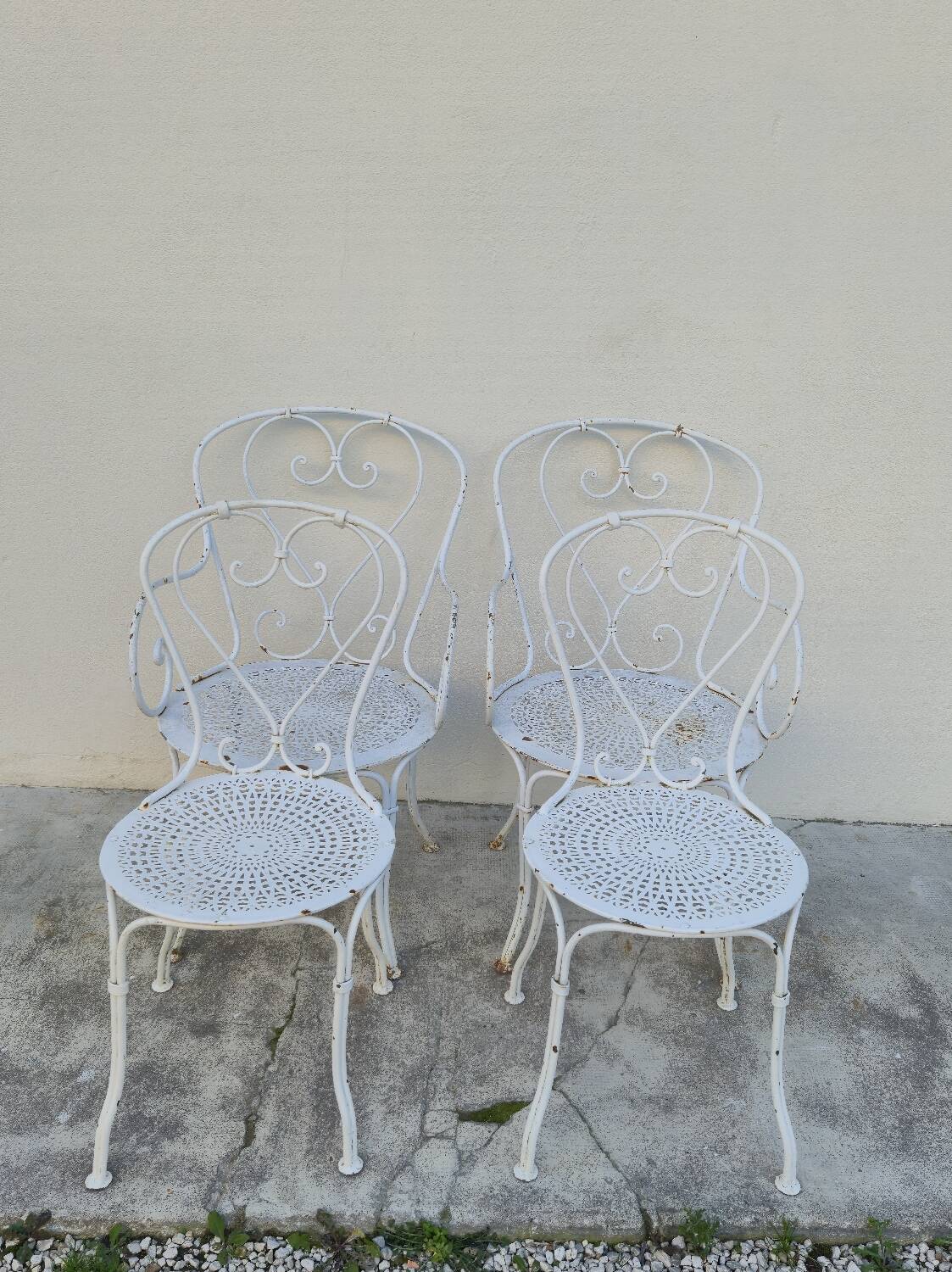 Garden furniture, two armchairs and two wrought iron chairs, period 1