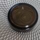 Dark smoked glass ashtray from the 1970s.
