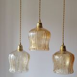 Trio of amber glass pendant lights
