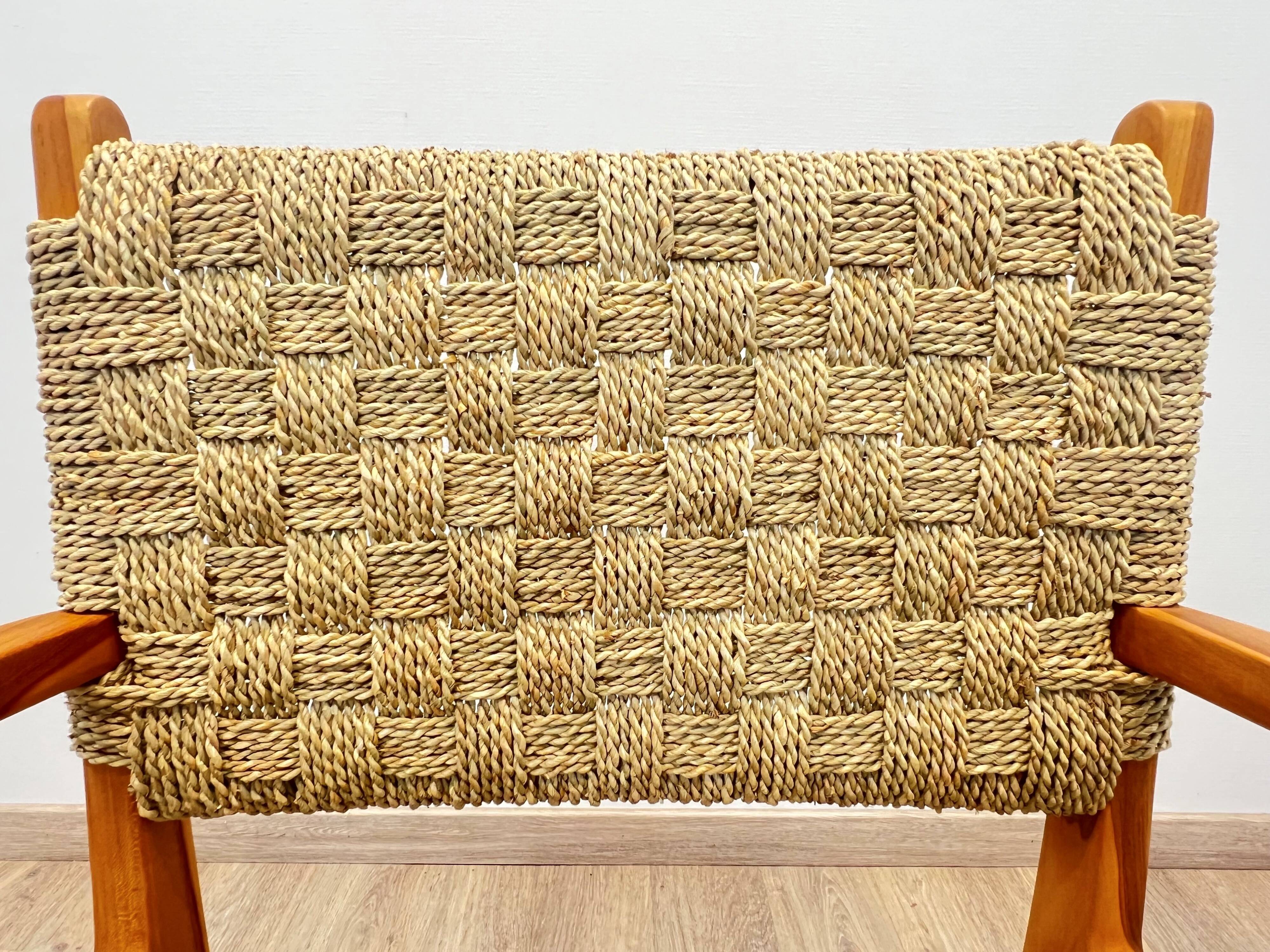 Pair of woven teak armchairs