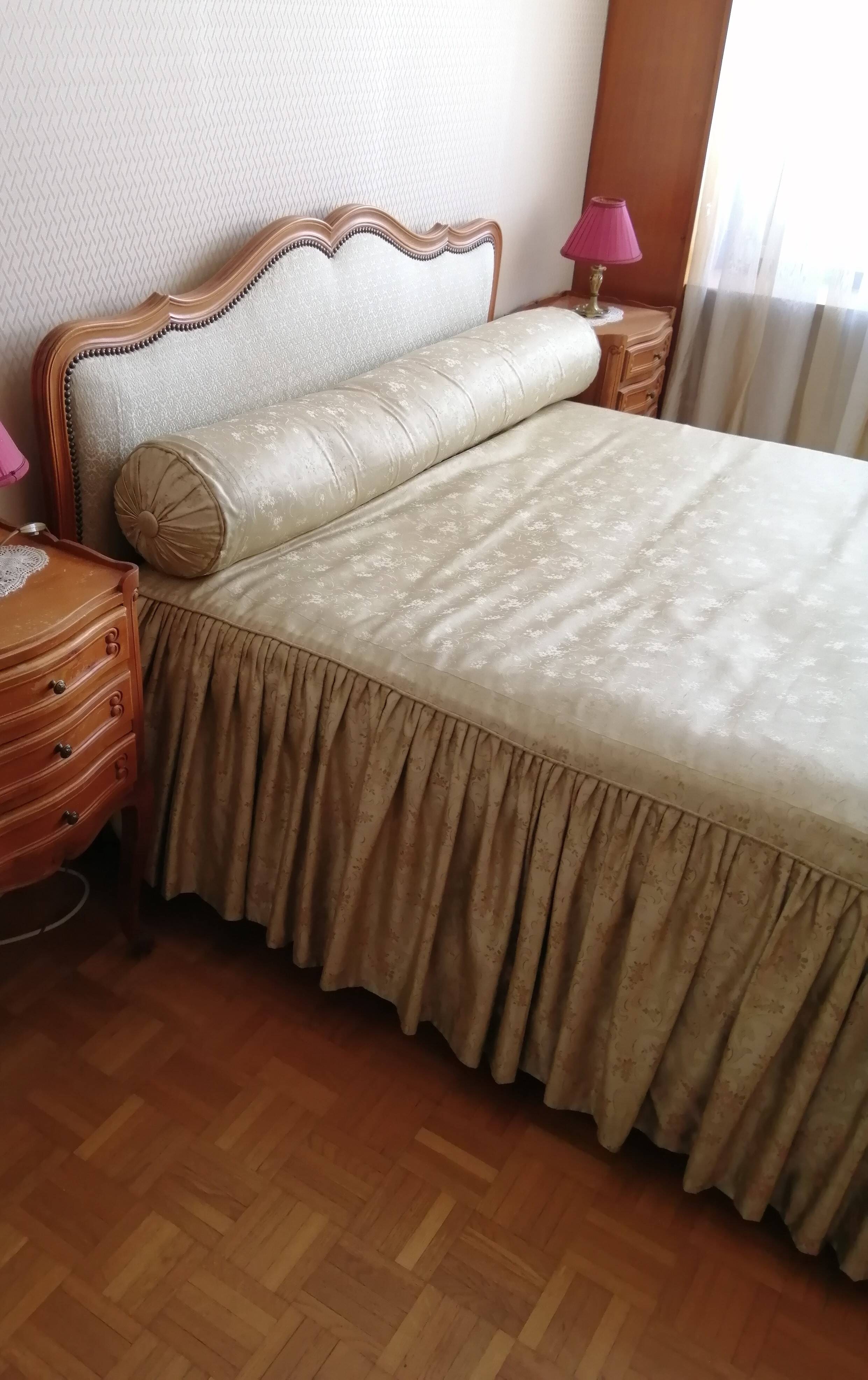 Cabinetmaker's bed frame and matching upholstered bedspread