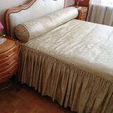 Cabinetmaker's bed frame and matching upholstered bedspread
