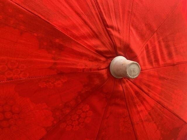 Large floral tilting beach umbrella with cotton fringes, 1960