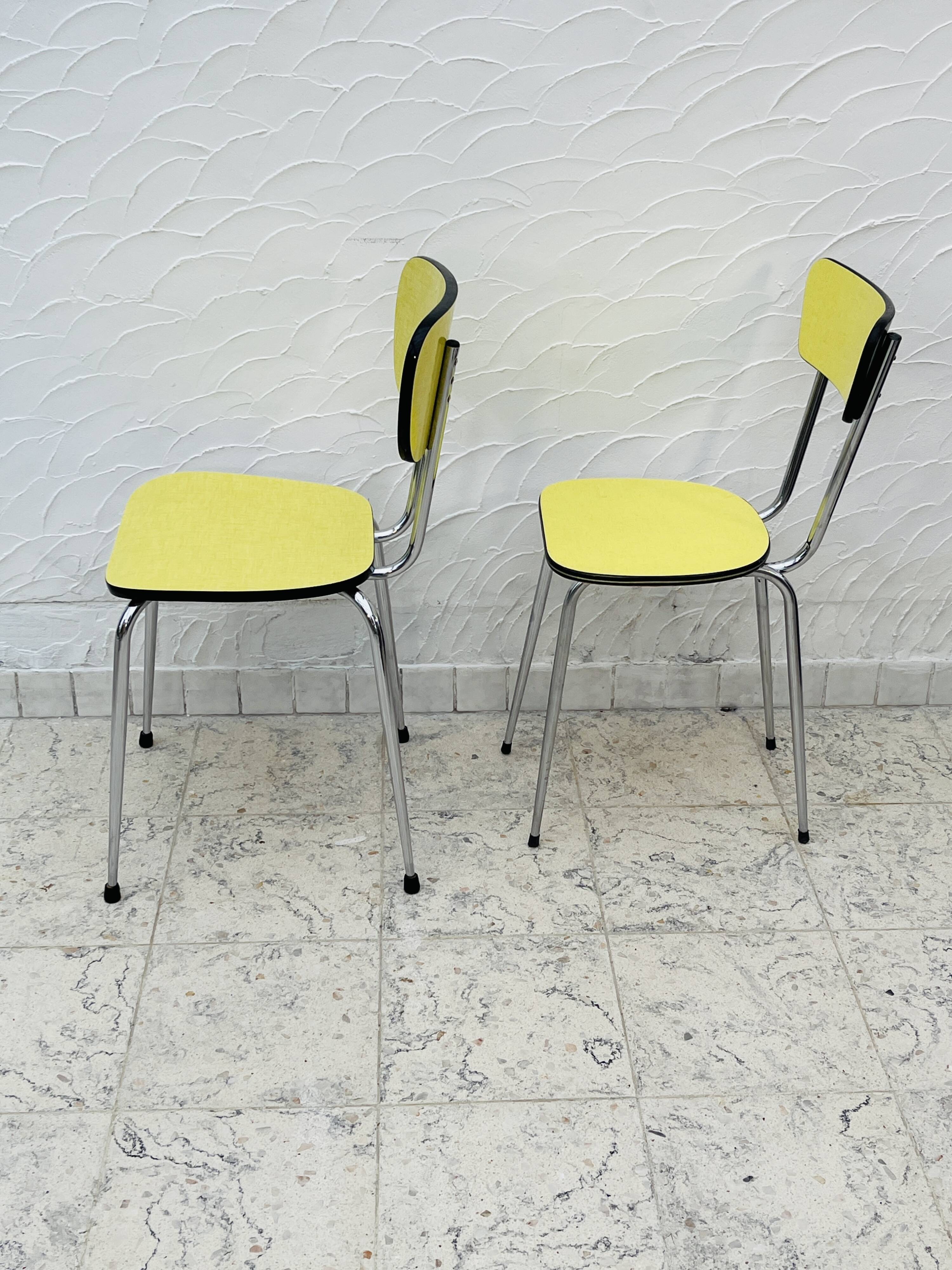 Pair of vintage yellow chrome Formica kitchen chairs.
