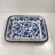 Set of 6 ceramic presentation plates in white and blue, floral pattern with woven wicker frame, 1970s/80s.
