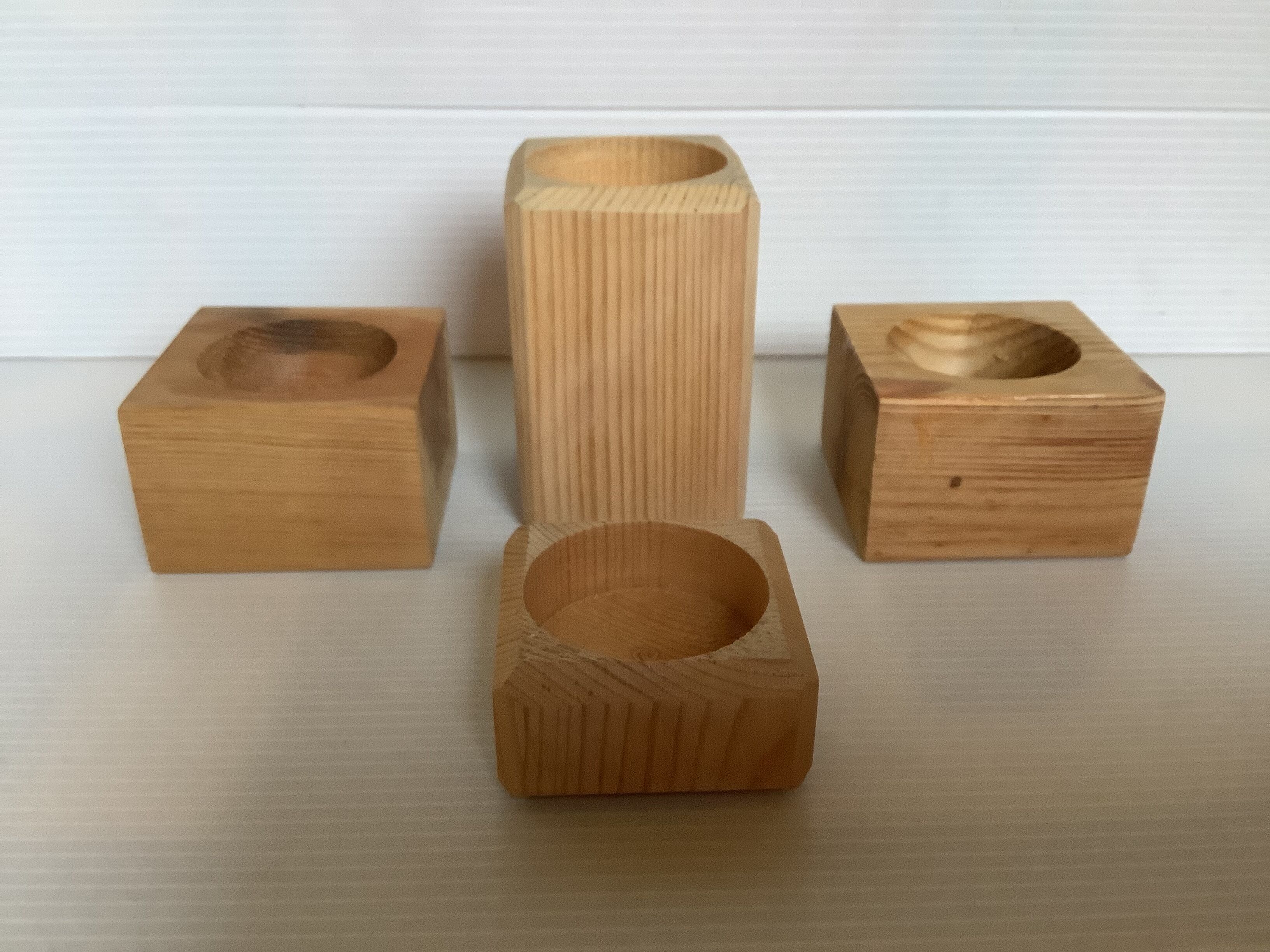 Set of four scandinavian wooden candle holders