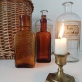 2 amber apothecary bottles