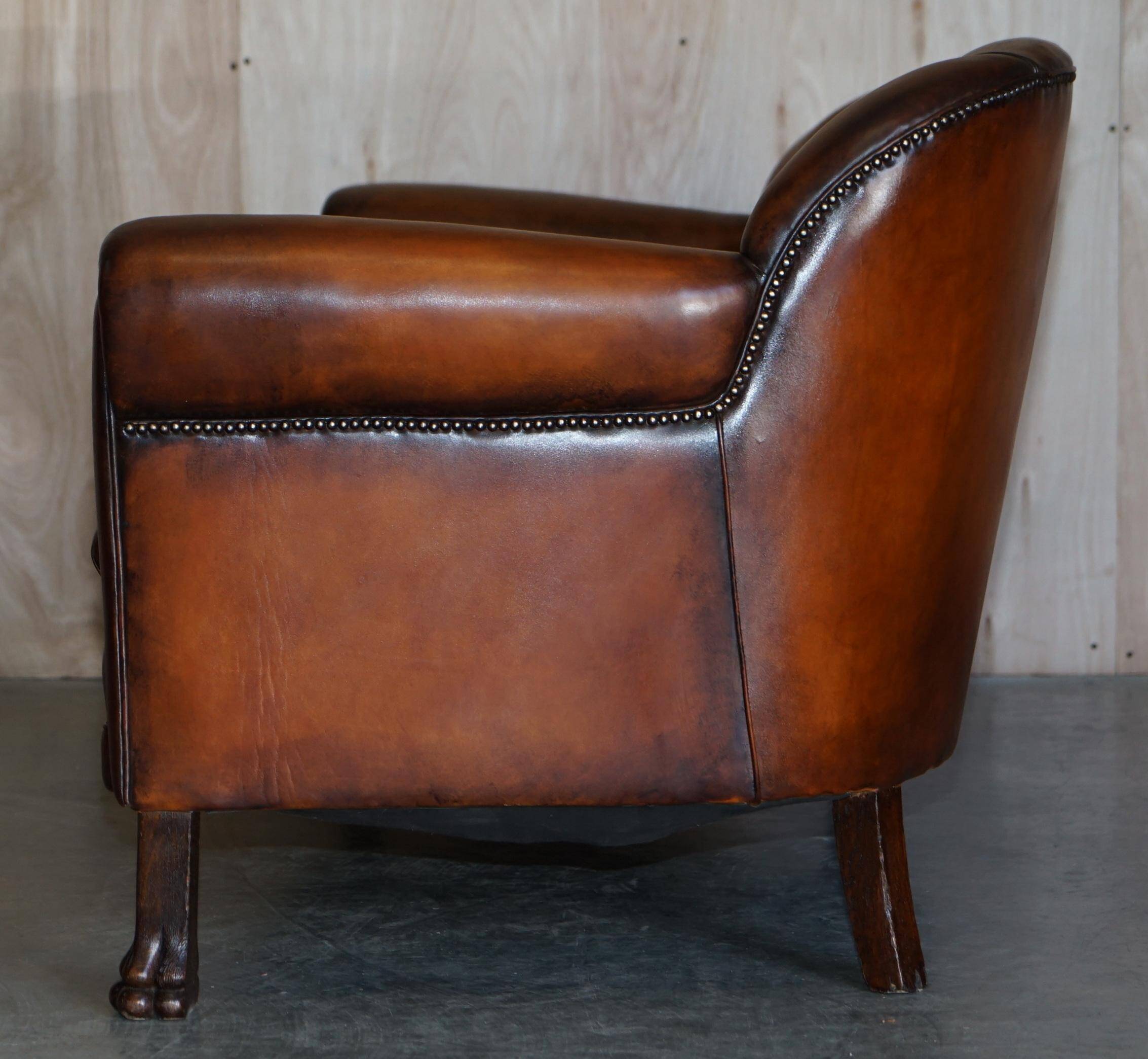 Victorian Chesterfield leather canapé with oak lion claw feet.