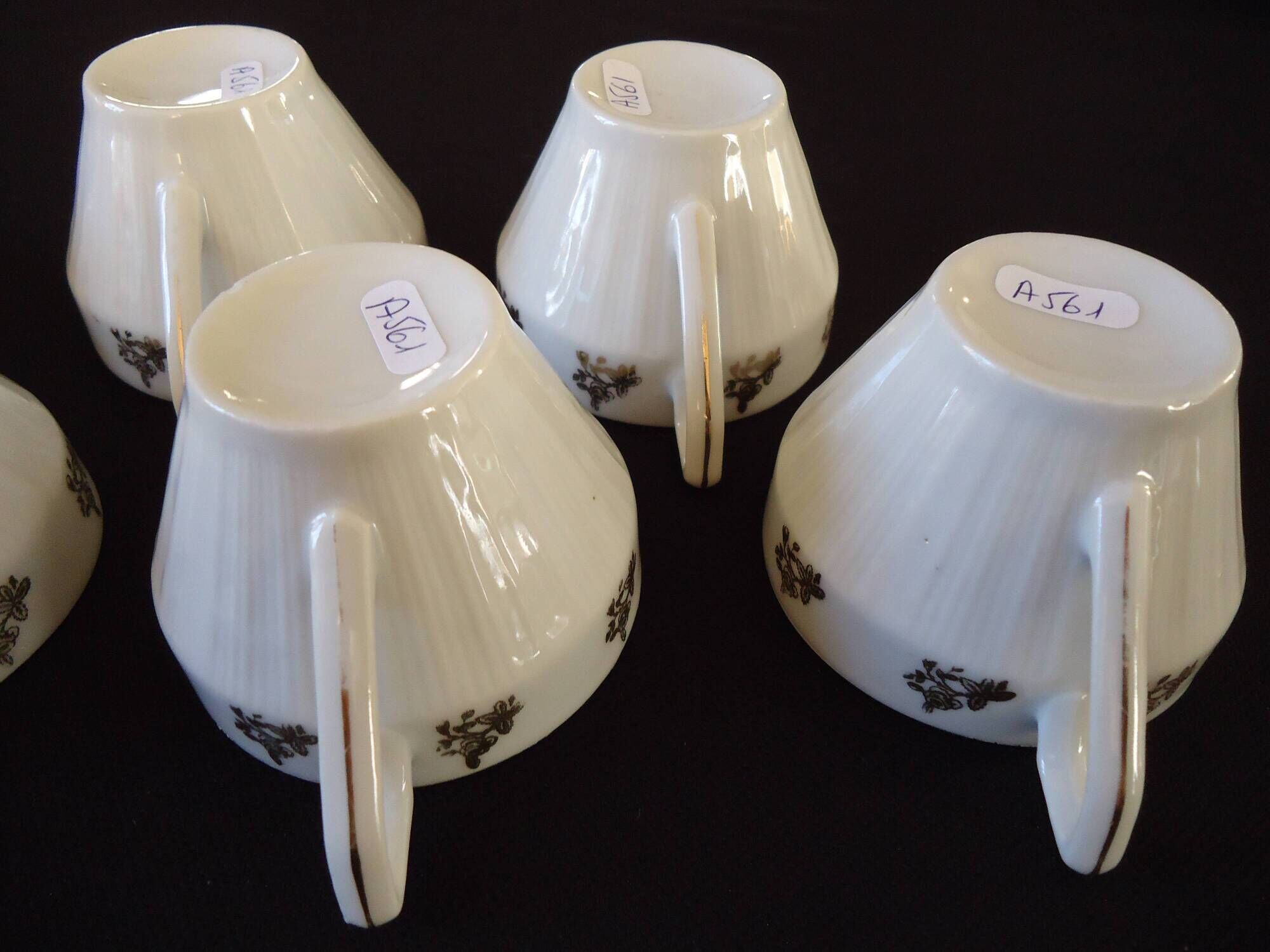 Set of six Art Deco white fine porcelain coffee cups and saucers
