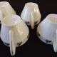 Set of six Art Deco white fine porcelain coffee cups and saucers