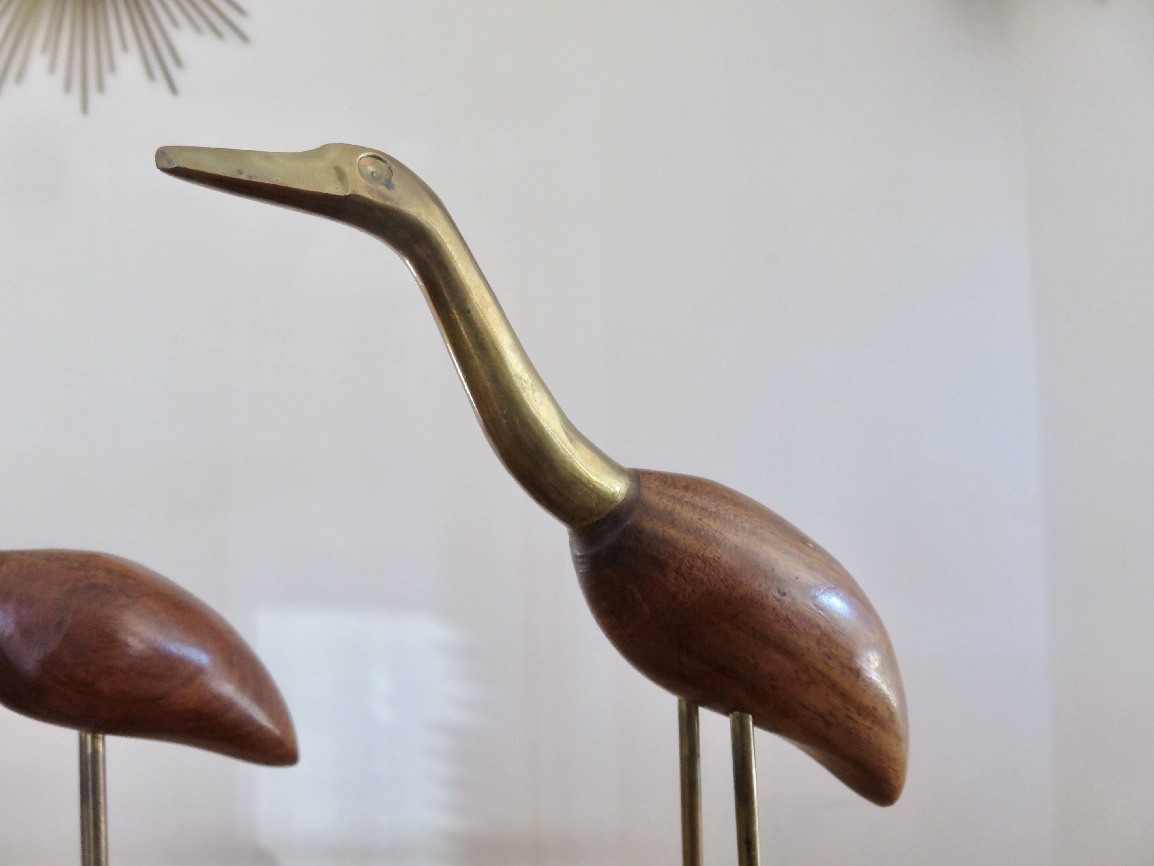 Pair of teak and brass herons from the 70s