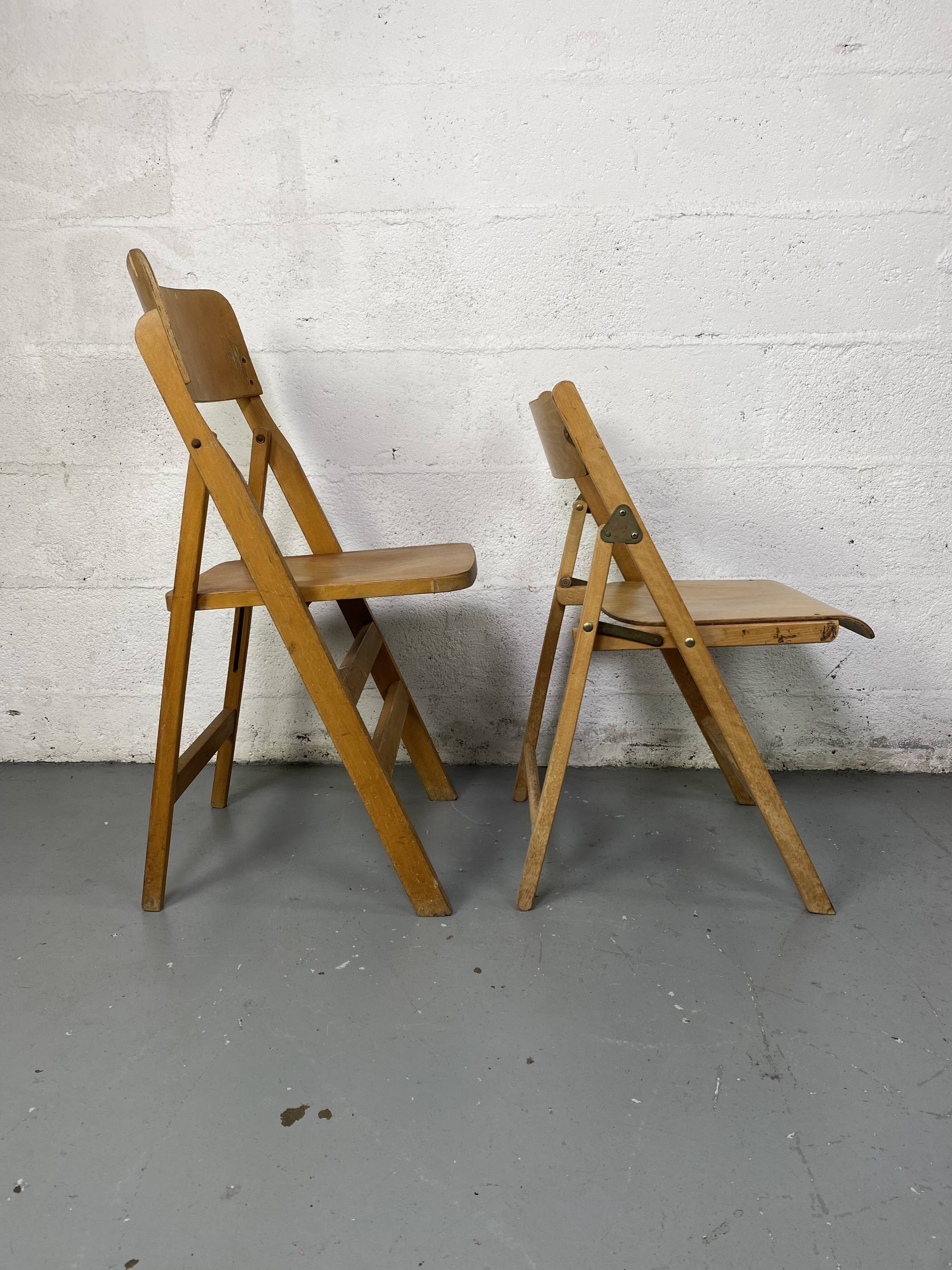 Pair of mismatched wooden folding chairs
