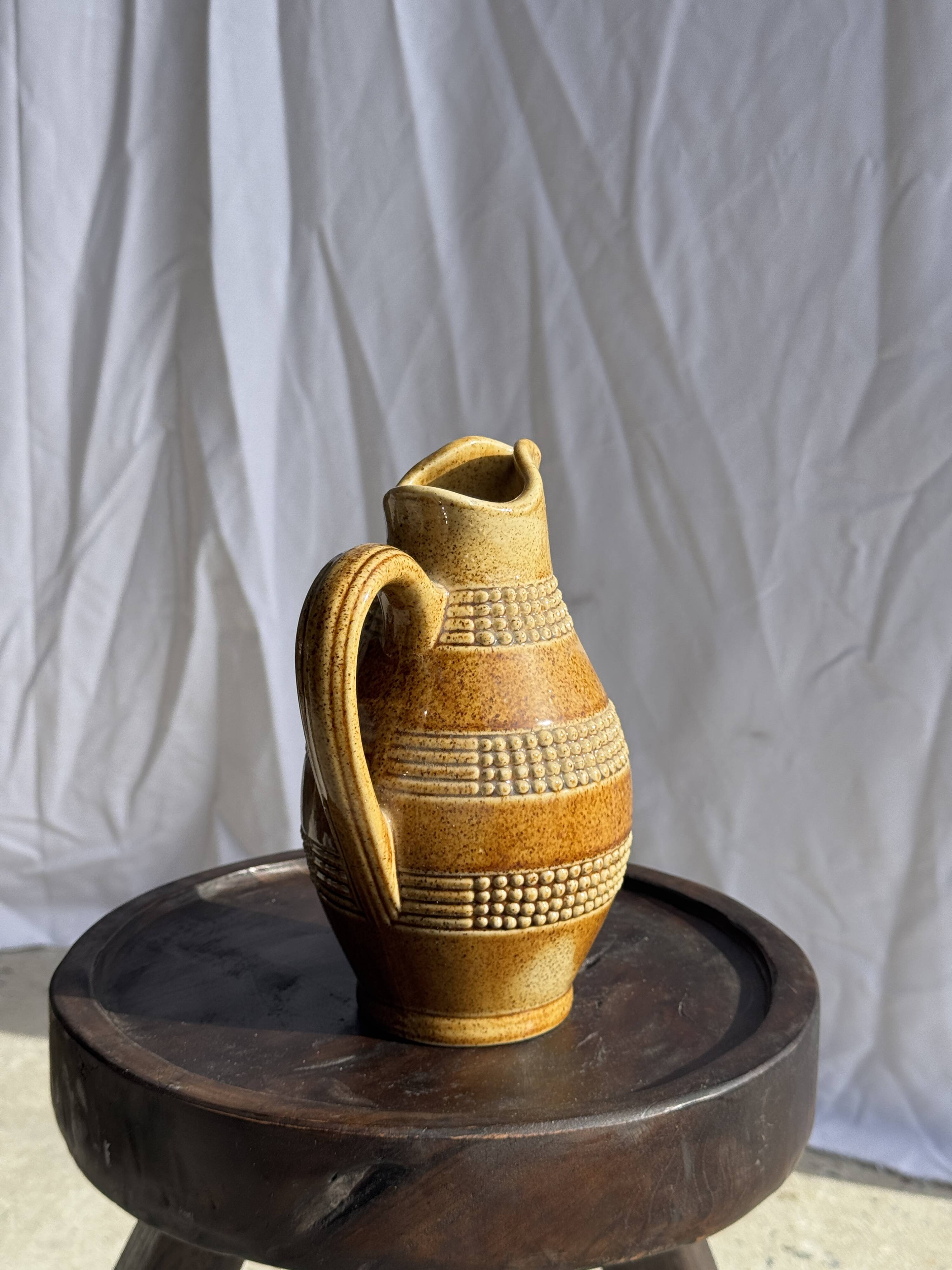 Vintage yellow stoneware carafe with beaded friezes Made in France H22