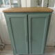 Vintage shoe cabinet smoked green wax finish, wooden top.