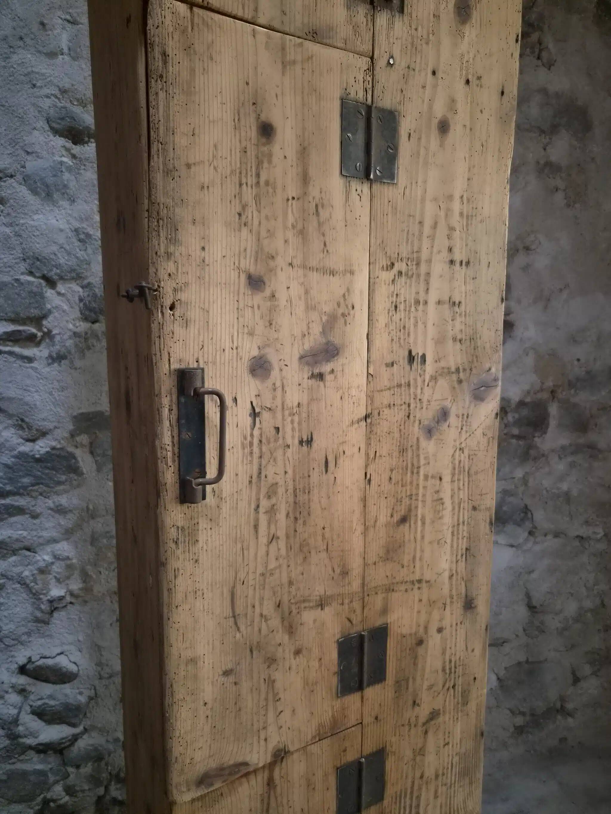 Antique French workshop cabinet in pine with compartments.