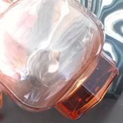 Vintage glass carafe in pink-orange, retro-chic style.