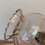 Pair of torch wall lights with iridescent pink glass shades and gold trim.