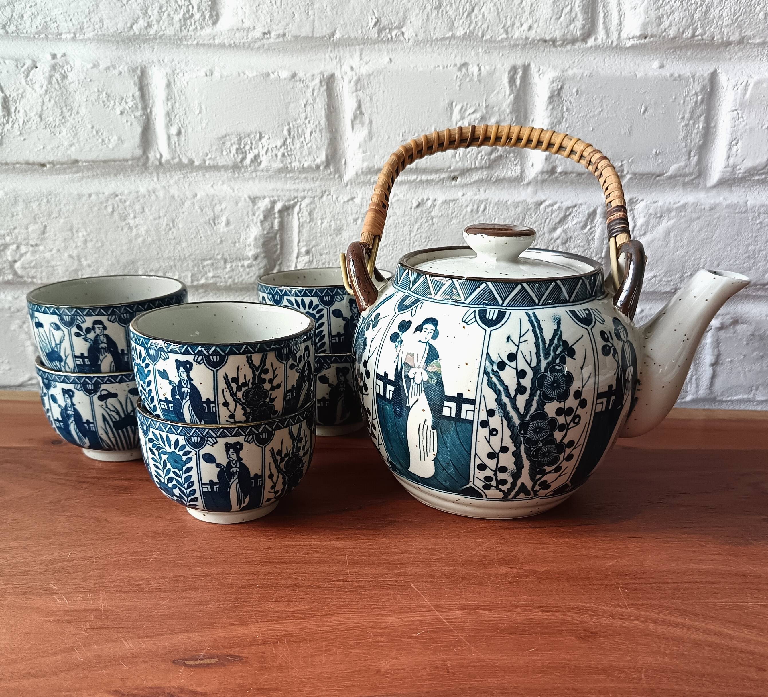 Asian ceramic and rattan tea set with plant geisha motifs