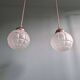 Art Deco trio of frosted glass pendants, 1920s-30s.