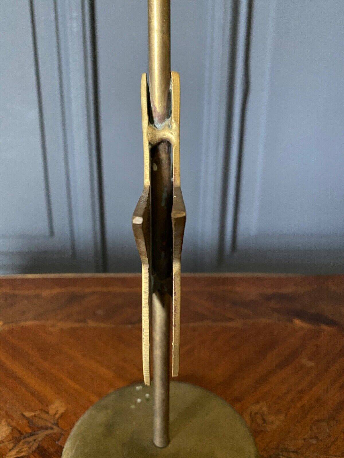 Pair of brass candlesticks decorated with 20th century stars