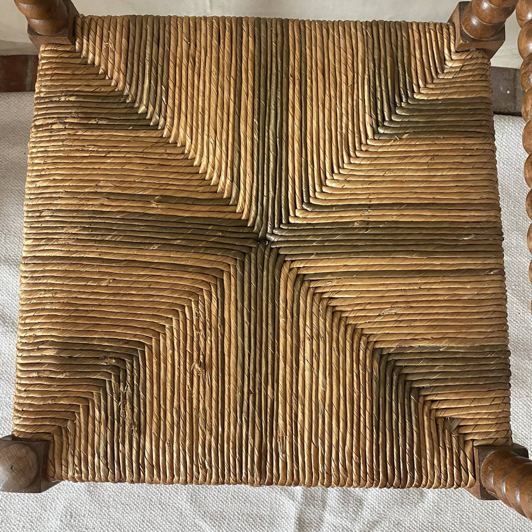 Corner chair in straw and turned wood, fireside chair.