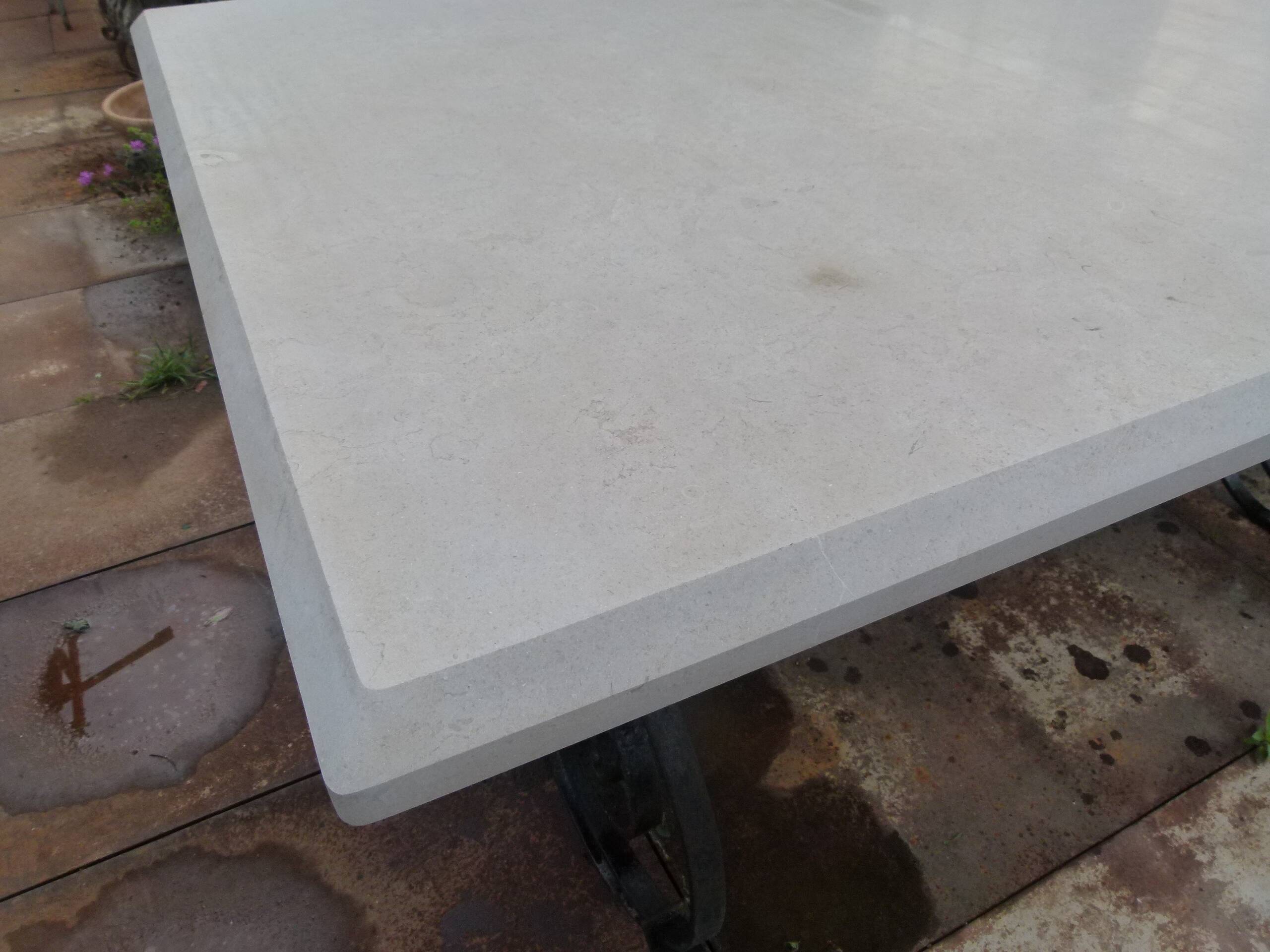 Marble table with wrought iron legs.