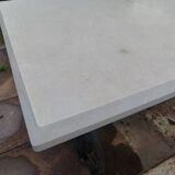 Marble table with wrought iron legs.