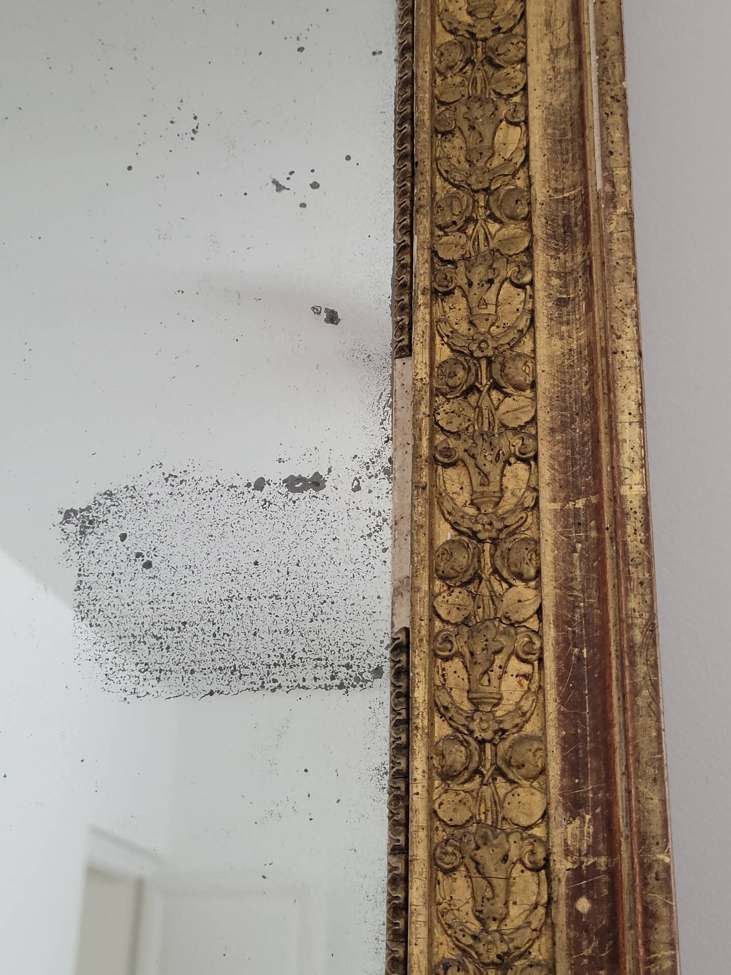 Golden stucco and wood Empire mirror