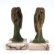 Art Deco pair of bookends with metal parrots and a marble base.
